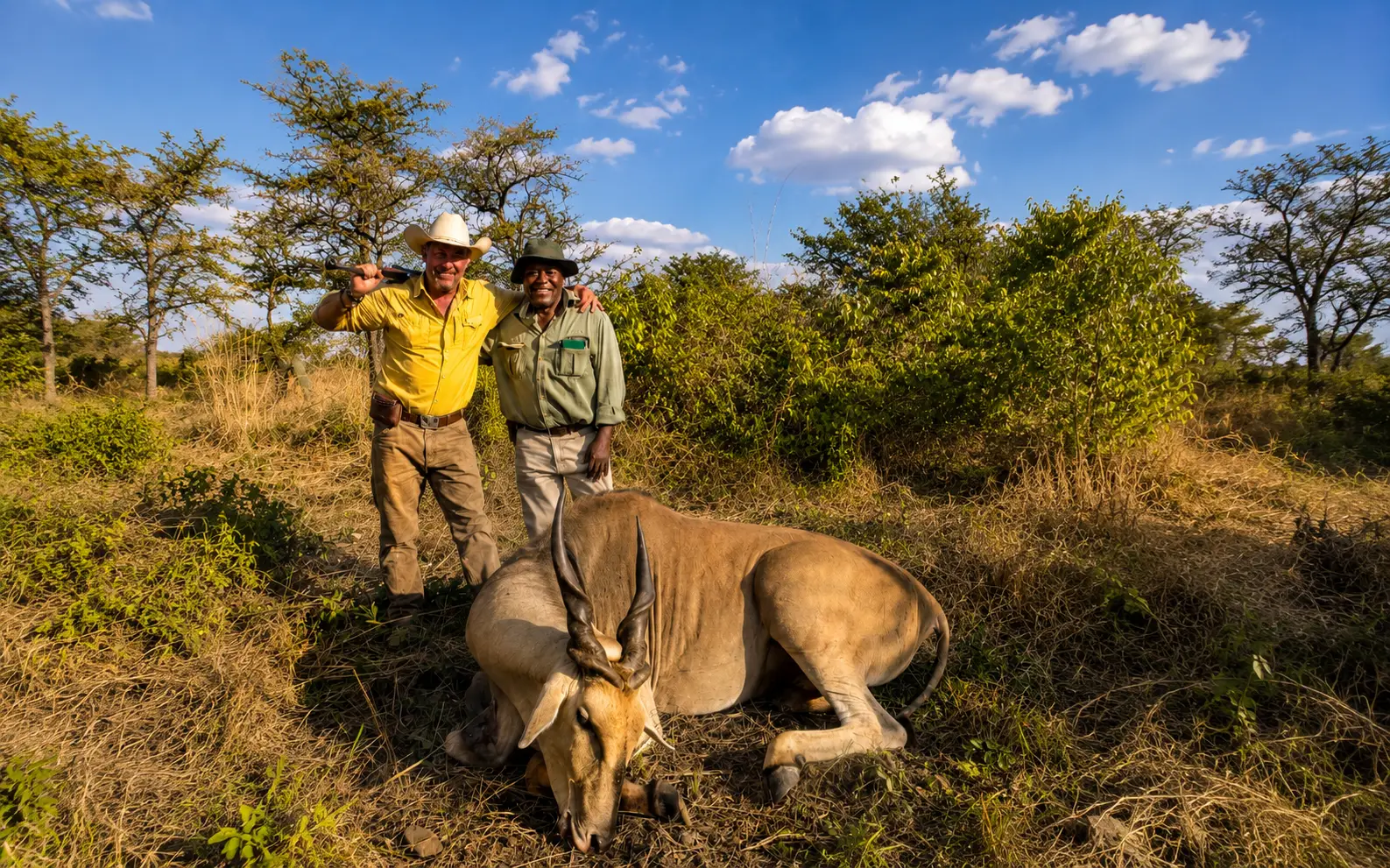Hunter and professional guide posing with an eland trophy in Zimbabwe